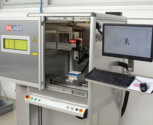 Inscripción láser en las instalaciones de OKW