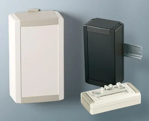 Wall suspension element and DIN rail clip as accessories